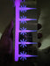 Pink Glow Urchin Minnow crappie bait glowing under UV blacklight