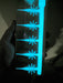 White Glow Urchin Minnow 2 inch panfish bait glowing blue in the dark