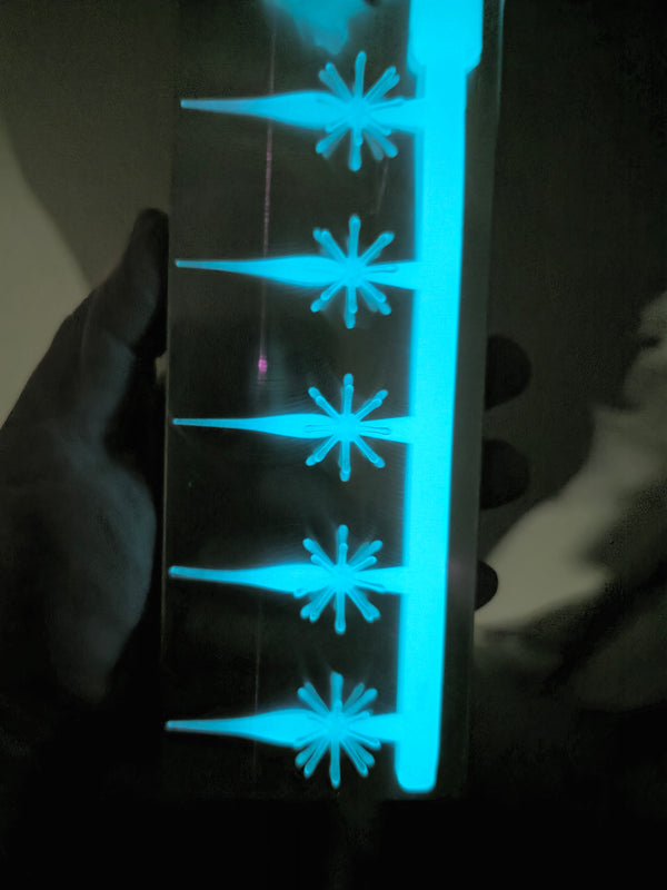 White Glow Urchin Minnow 2 inch panfish bait glowing blue in the dark